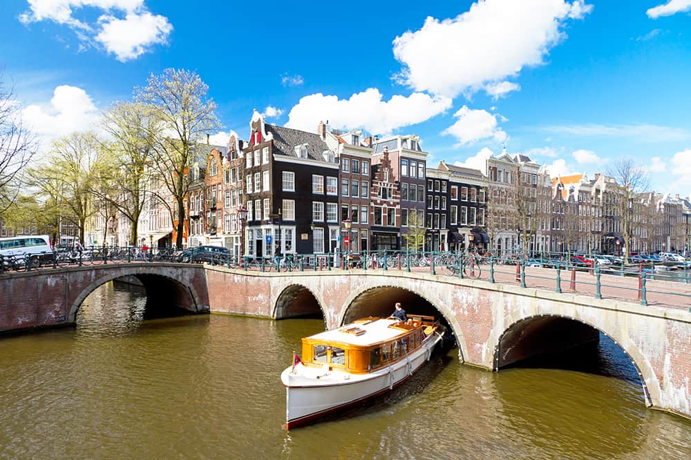 Amsterdam Canal Intersection White Boat